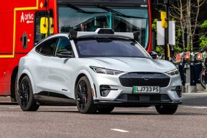Uber brings forward trialling driverless taxis in UK.
