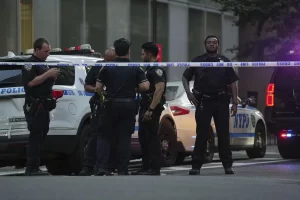 Police officer among four dead in shooting at New York City office building.