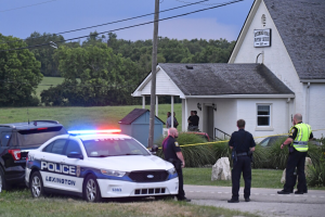 Two women killed at Kentucky church as gunman opens fire after shooting officer.