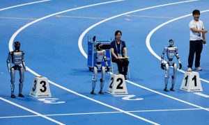 Robots race, play football, crash and collapse at ‘Olympics’.