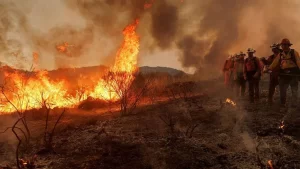 Rapidly growing fire prompts thousands of evacuations in California.