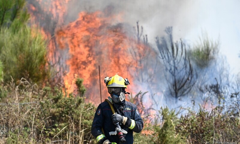 Portugal suffers new wildfire death; Spain beats back blazes.