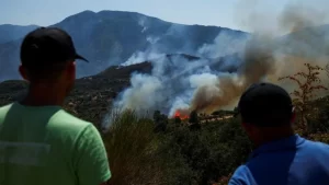 Wildfires rage across southern Europe as temperatures top 40C.