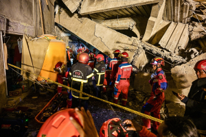 Three dead, dozens trapped after Indonesian school collapses on students.