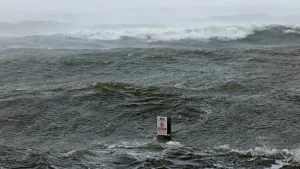 Storm kills two in France; strong gusts hit coast.