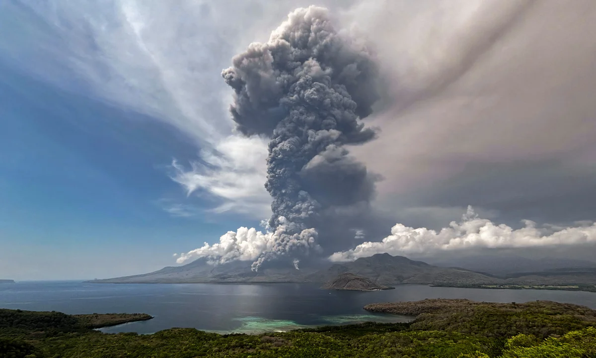 Volcano erupts near Bali, sending ash into the sky.