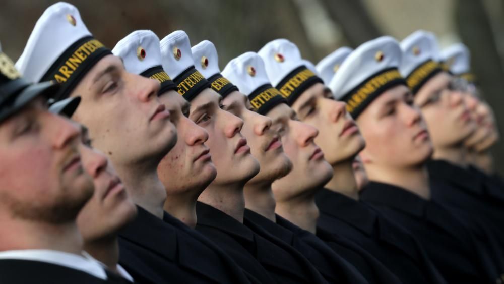 Germany votes to bring in voluntary military service programme for 18-year-olds.