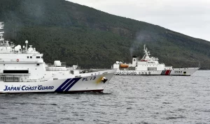 Chinese and Japanese boats face off near disputed islands as feud worsens.