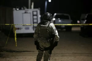 Gunmen storm Mexico football pitch and kill at least 11 people.