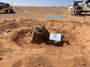Bodies of 21 migrants found in Libyan grave.