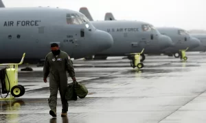 A US soldier is seen in front of C-130 transport planes at Yokota US Air Force Base in Fussa, on the outskirts of Tokyo, Japan on May 21, 2020..