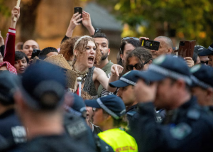 Australia police defend actions after violence at protest over Israeli president visit.