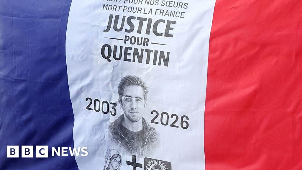 Demonstrators in Paris carried flags calling for justice during a rally paying tribute to Quentin Deranque over the weekend.