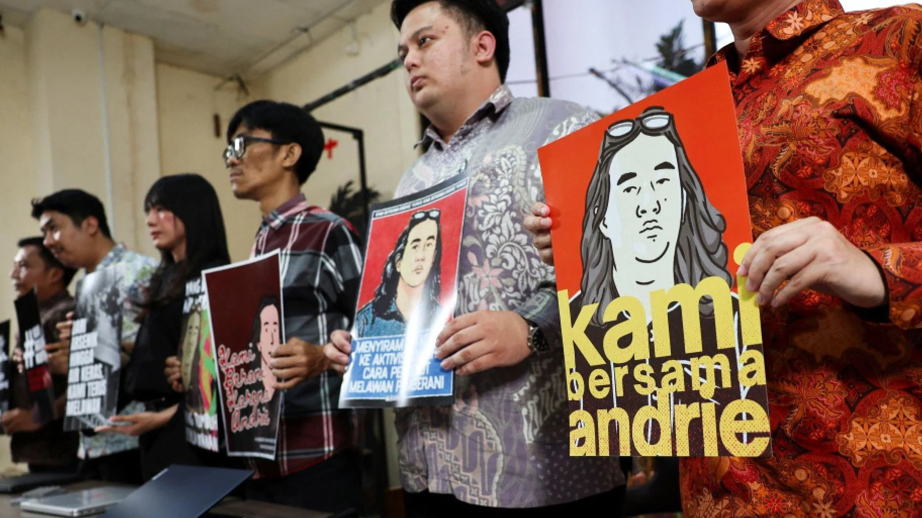 Activists hold a press conference in support of Andrie Yunus.