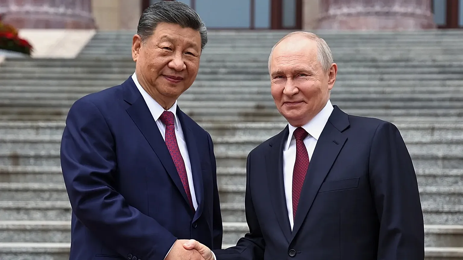 Xi and Putin signal united front against US in Beijing talks.