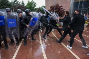 Turkish riot police storm opposition offices after leaders ousted.