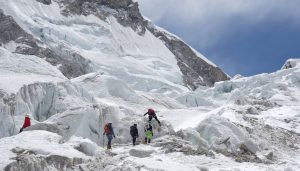 Climbers clear path to Everest summit past giant chunk of ice.
