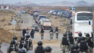 Bolivian minister's convoy ambushed while overseeing roadblock clearance.