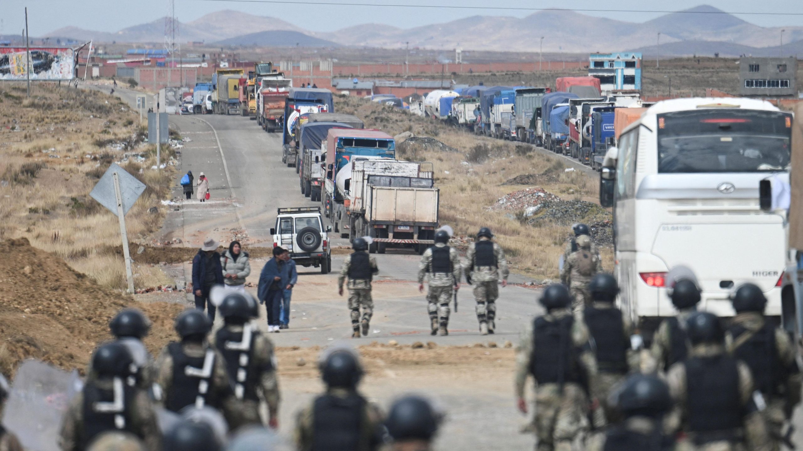 Bolivian minister's convoy ambushed while overseeing roadblock clearance.