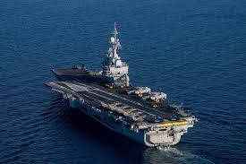 This photograph taken on April 27, 2026, shows an aerial view of the French aircraft carrier Charles de Gaulle at the end of the NATO military exercise Neptune Strike 26-2, off the coast of the Greek island of Crete.