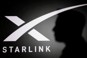 The silhouette of Elon Musk and Starlink logo are seen in this illustration taken June 11, 2026.