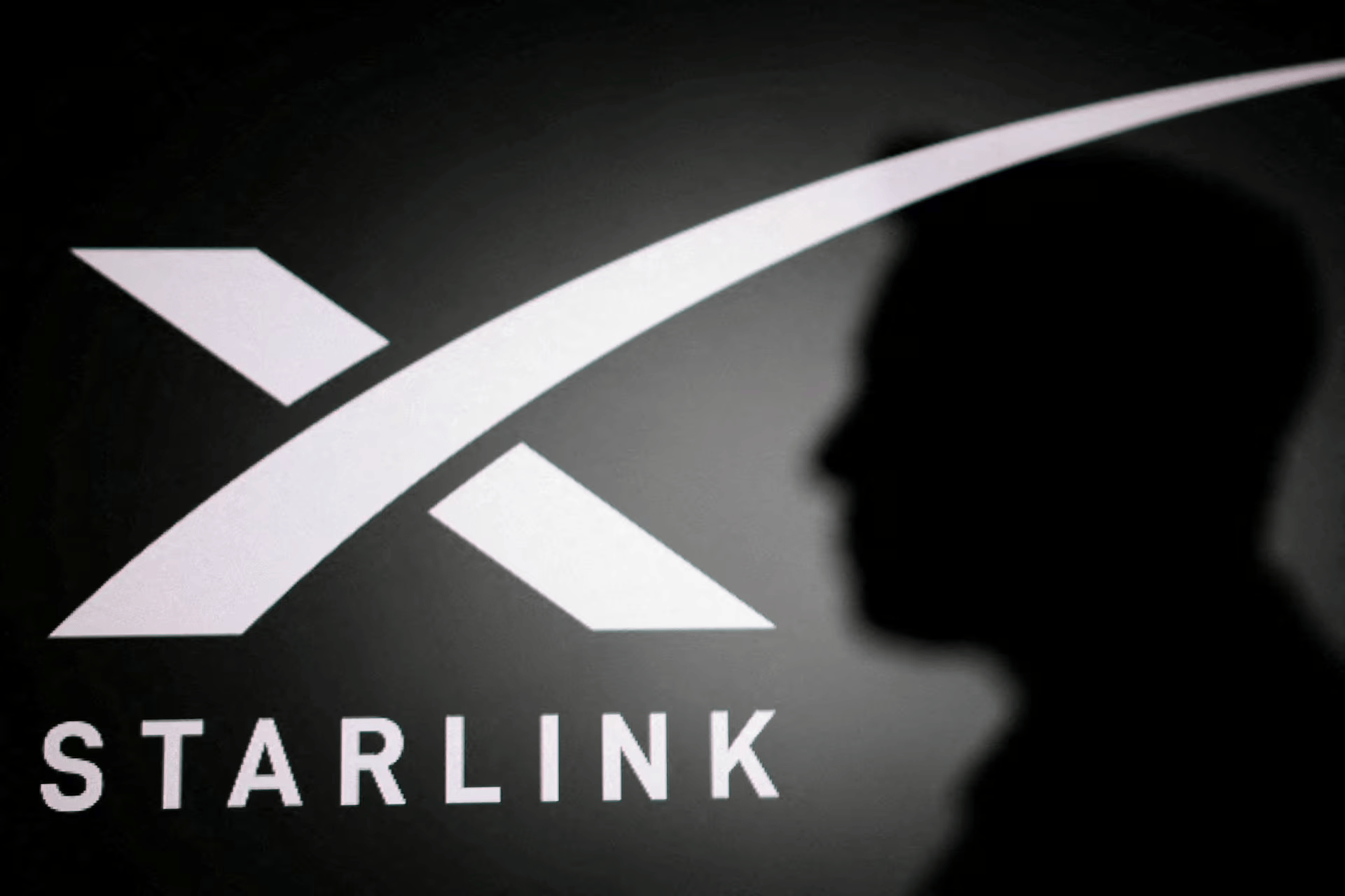 The silhouette of Elon Musk and Starlink logo are seen in this illustration taken June 11, 2026.