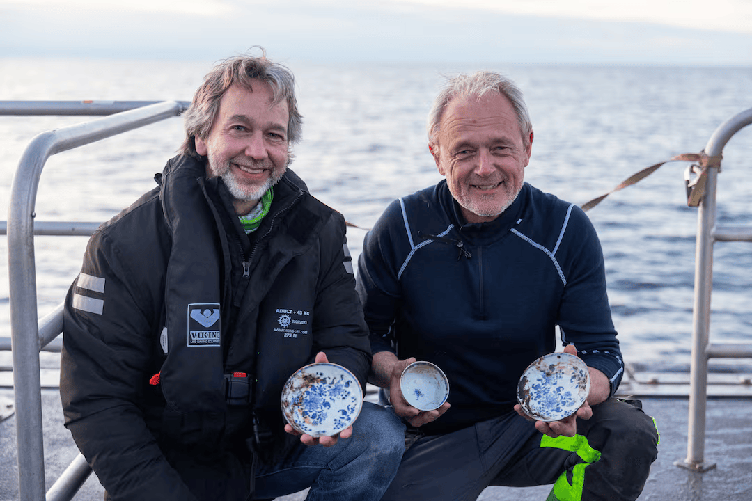 Officials pose with a trove of Chinese porcelain from a recently discovered 18th-century shipwreck off the coast of Norway.