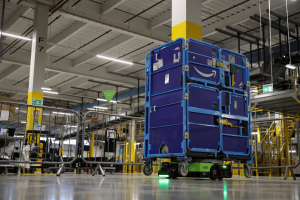Amazon unveils robotic AI warehouse in UK.