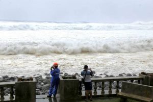 East Asia braces for destructive typhoon as landslides kill 15 in Philippines.