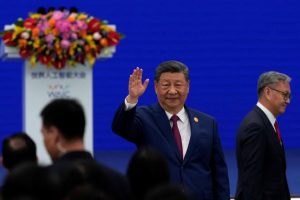 Chinese President Xi Jinping waves as he arrives at the opening ceremony for the World AI Conference in Shanghai, China, July 17, 2026.