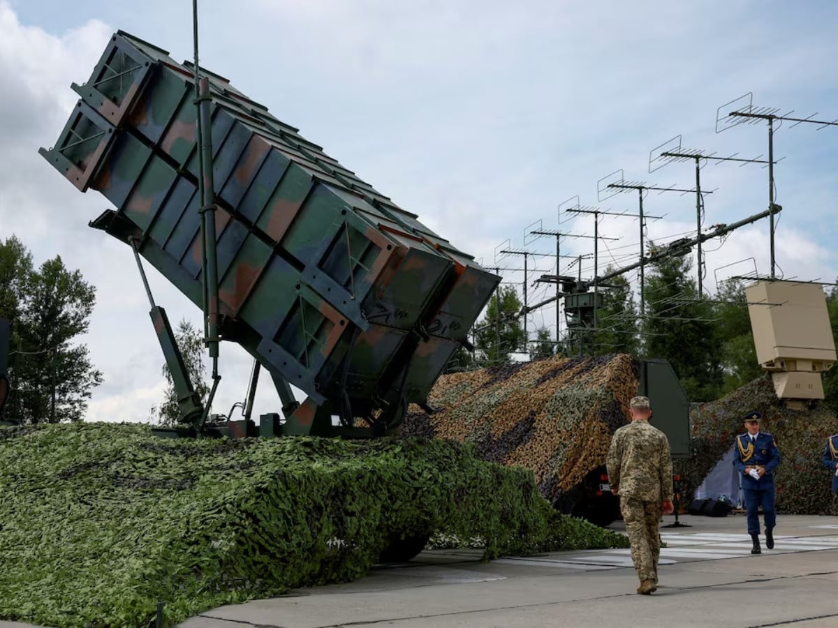 Ukrainian service members walk next to a launcher of a Patriot air defence system, amid Russia's attack on Ukraine, in an undisclosed location, Ukraine August 4, 2024.