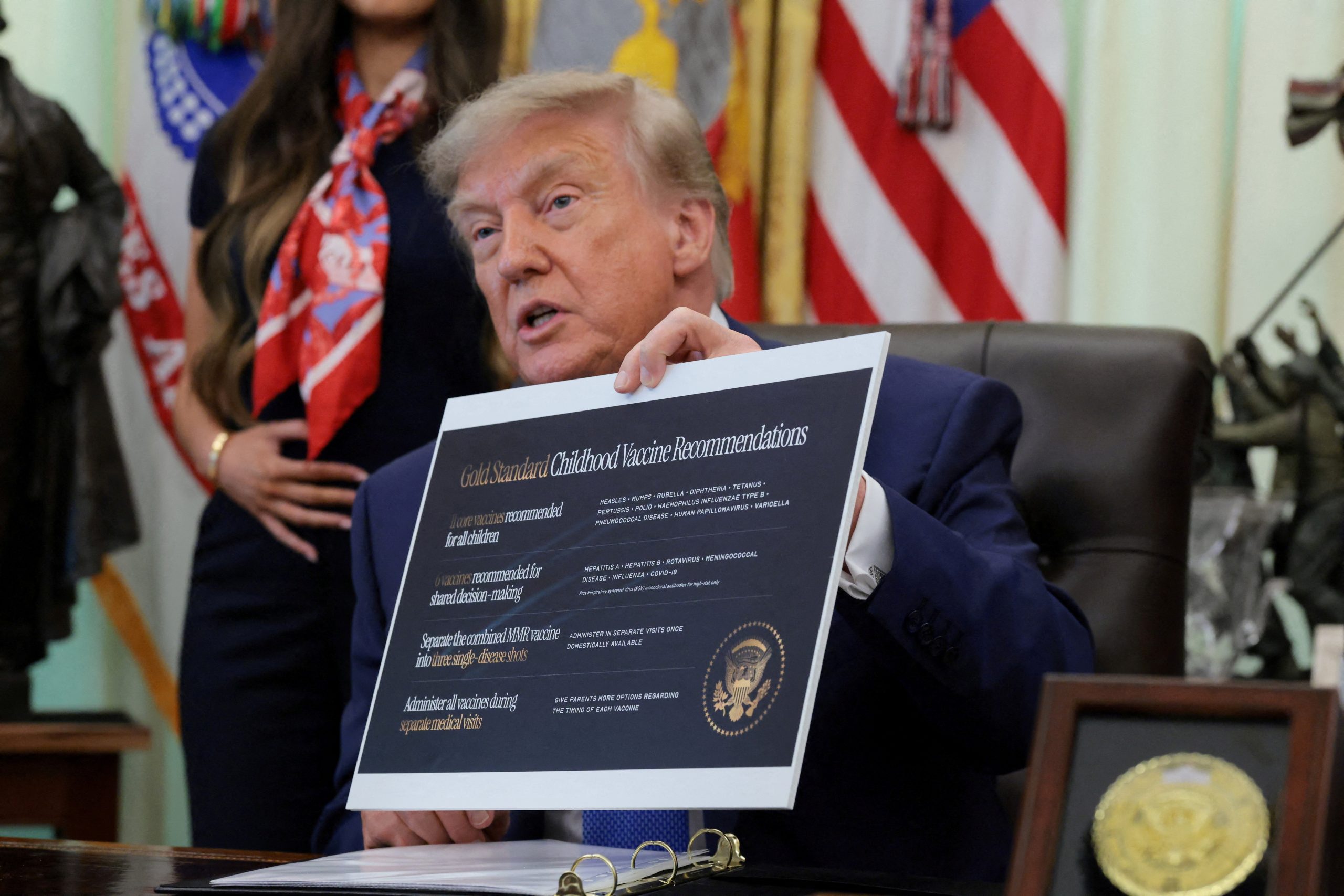 U.S. President Donald Trump speaks during an event to sign an executive order regarding vaccine flexibility, in the Oval Office at the White House in Washington, D.C., U.S., August 10, 2026.
