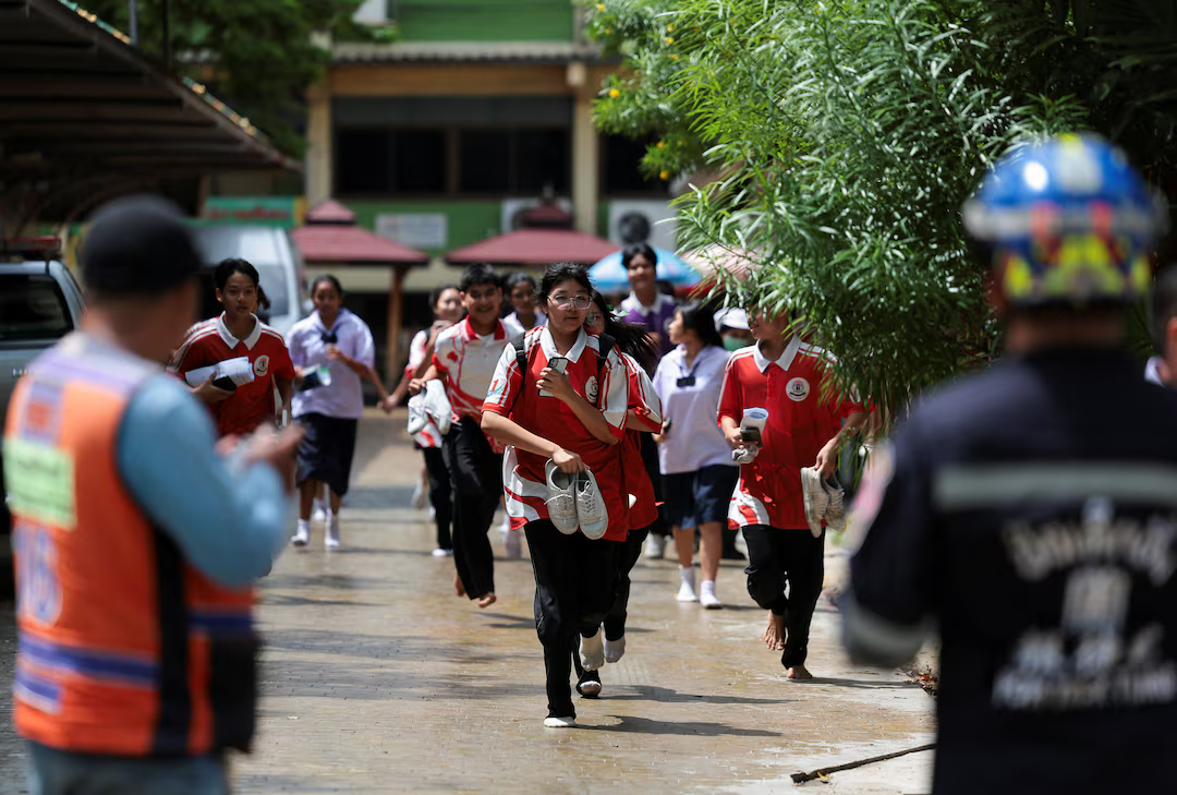 Students run as they evacuate from Debsirin Nonthaburi School, the site of a shooting incident, in Bang Kruai district in Nonthaburi province on the outskirts of Bangkok, Thailand, August 7, 2026.