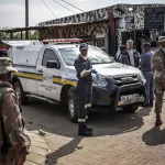Gunmen kill 27 in 2 separate shootings in South Africa.