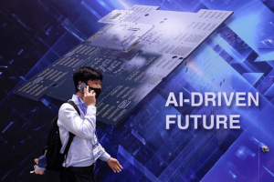 A visitor walks past a display reading "AI-DRIVEN FUTURE" during SEMICON Taiwan in Taipei, Taiwan, September 2, 2026.