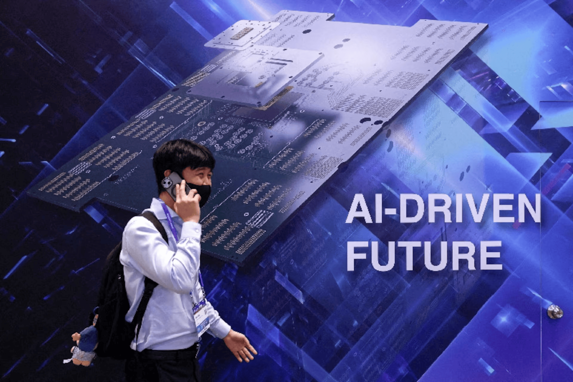 A visitor walks past a display reading "AI-DRIVEN FUTURE" during SEMICON Taiwan in Taipei, Taiwan, September 2, 2026.