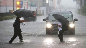 Millions urged to evacuate as powerful Typhoon Dujuan hits Japan.