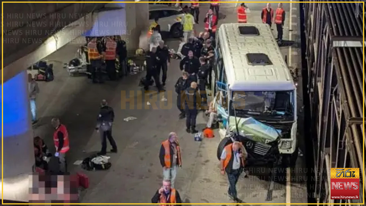 Bus hits train stopped on French side of Channel Tunnel, with 19 injured.