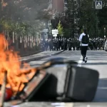 Students torch two schools as protests rage across France.