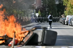 Students torch two schools as protests rage across France.